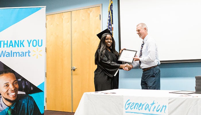 Graduate Aaliyah Belton receives her diploma from Chris Rick, Generation Instructor